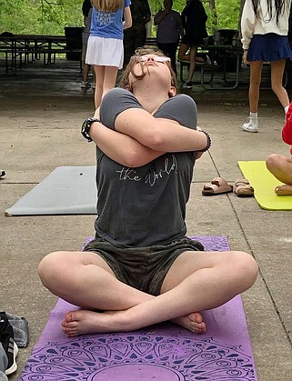 Joe Gamm/News Tribune photo: 
Danielle Brenner, 14, stretches for yoga during the annual Zonta Club's Girl Empowerment Day held Saturday morning, April 27, 2024. During the event, members of the Z Club (a club intended to build confidence in high-school girls) host speakers and activities for middle-school girls.